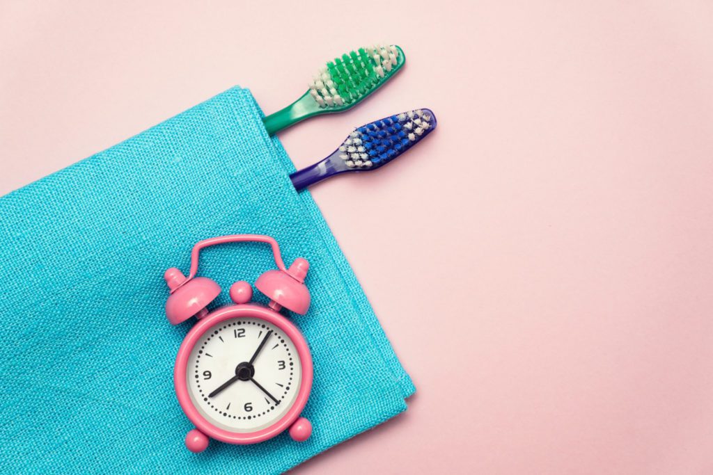Toothbrush and alarm clock
