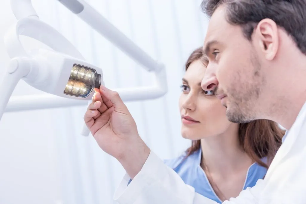 Dental X-Rays 21 man and woman looking at dental x-ray