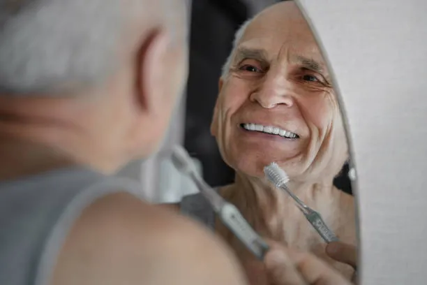 Dental Bridge 23 old man brushing his teeth