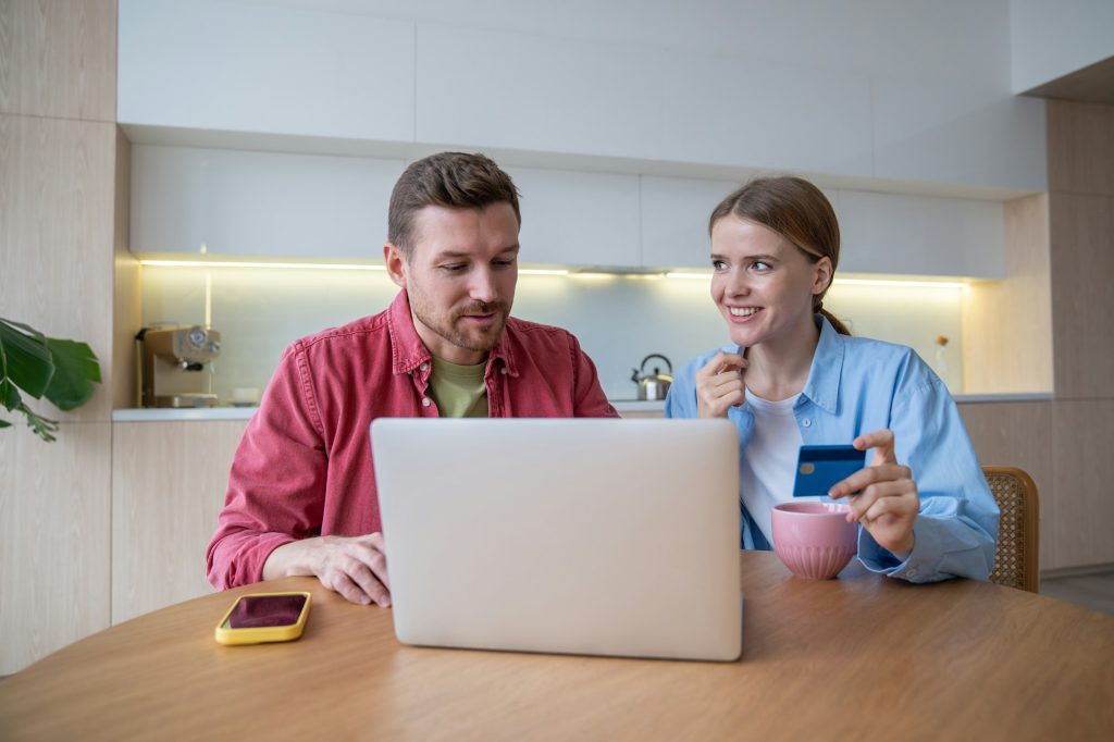 Children with Autism 11 Millennial couple makes great deals online using laptop of comfort home. Convenience online shopping