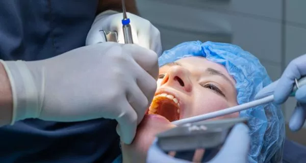 How is wisdom tooth removal done?